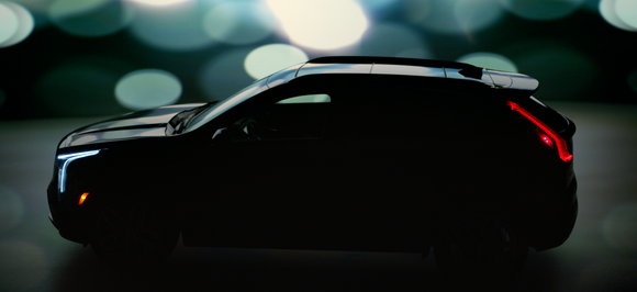 A Cadillac XT4's outline is visible in a darkened "teaser" image.
