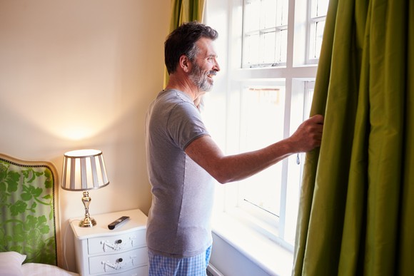 Man looking out the window