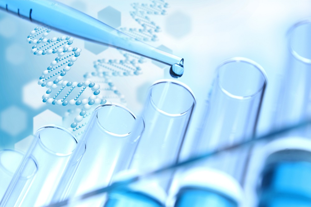 A pipette dropping liquid into test tubes.