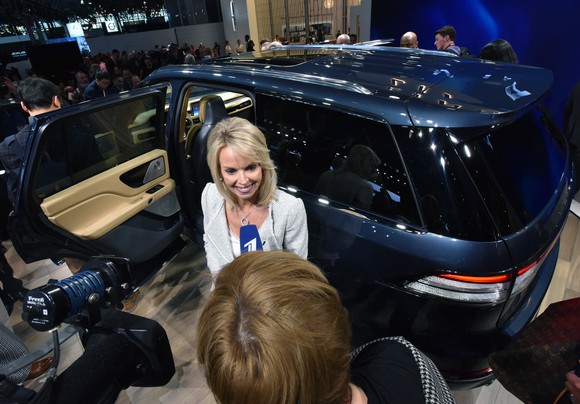 Falotico is shown standing in front of the all-new Lincoln Aviator as she is interviewed by a journalist.