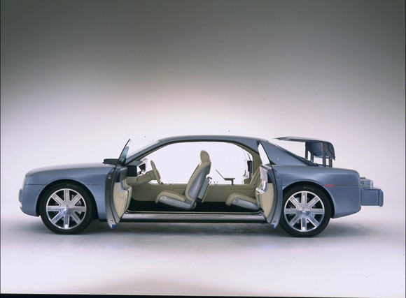 The 2002 Lincoln Continental Concept, a show-car take on a large luxury sedan, with its doors open showing the "suicide doors" in the rear.