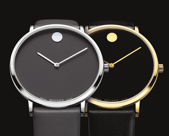 Silver and gold Movado watches with black bands and faces