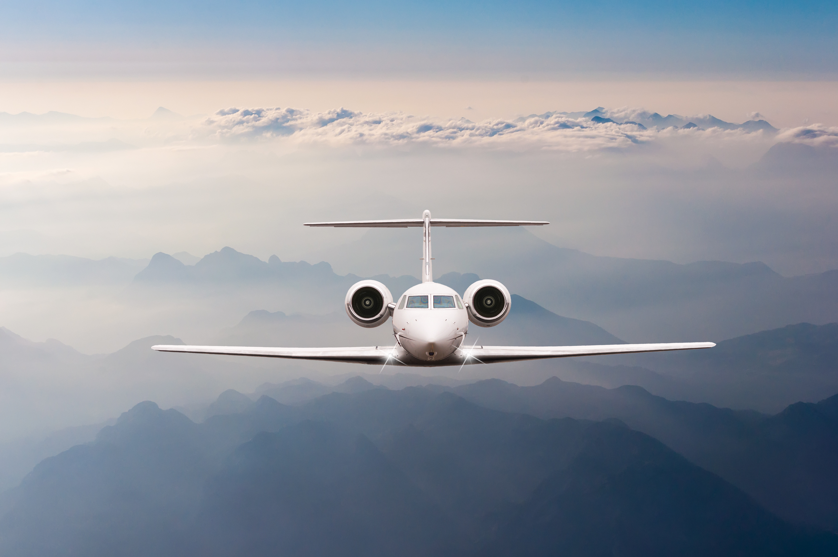 Aircraft flying above the clouds.