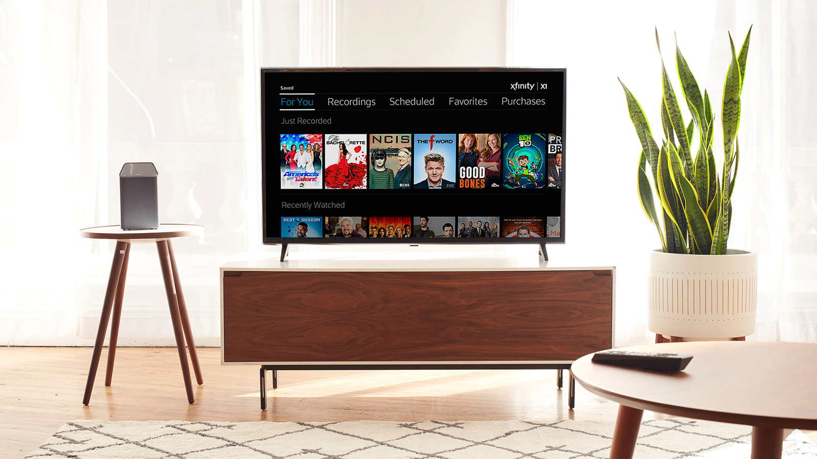 A TV in living room displaying Comcast Xfinity platform.