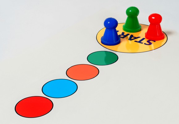 Game pieces are shown at start in a game board.
