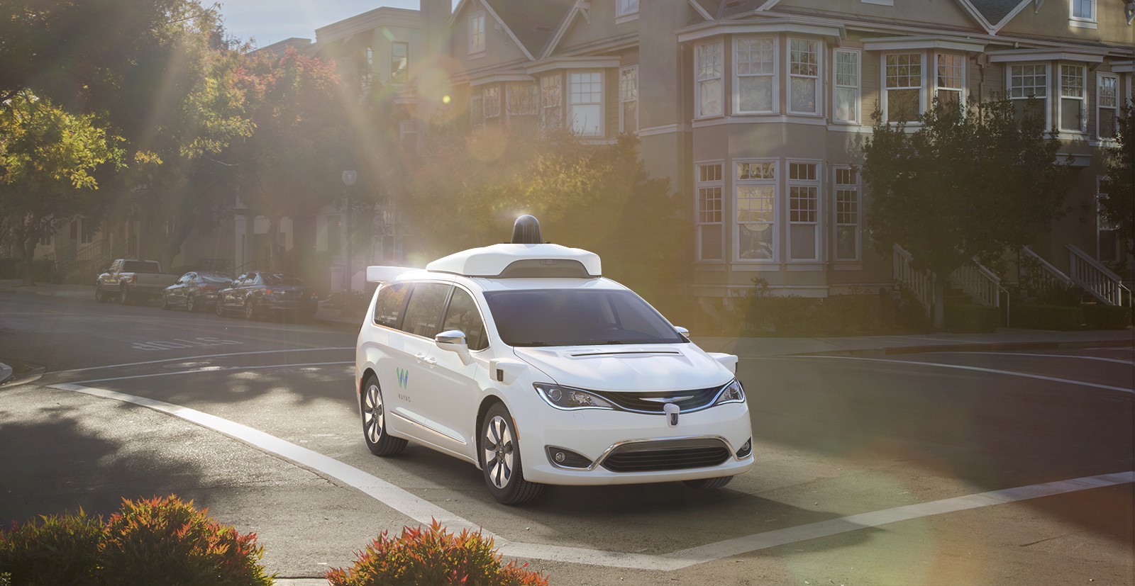 Image of a minivan in an intersection.