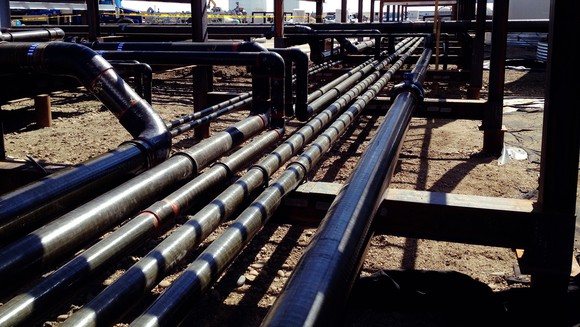 Complex network of pipelines converging at a central network node.
