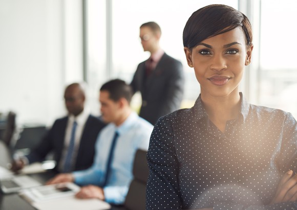 Business woman leading a meeting of employees