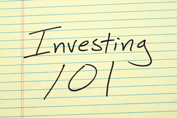 yellow lined paper, on which is written investing 101