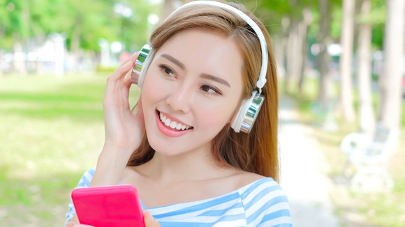 Woman listening to headphones
