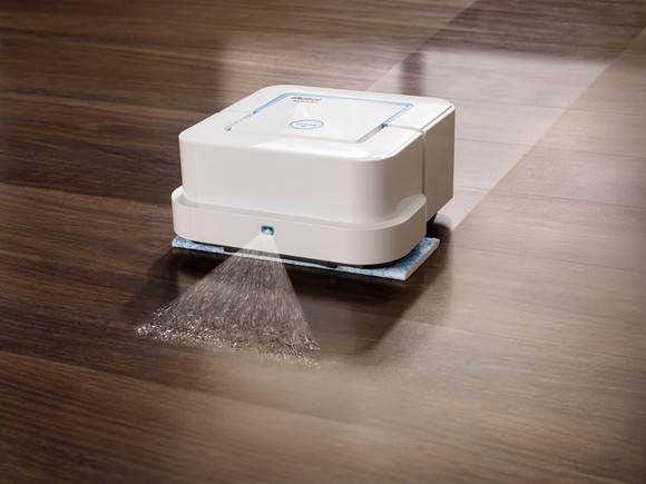 iRobot Braava mopping robot cleaning a wood floor