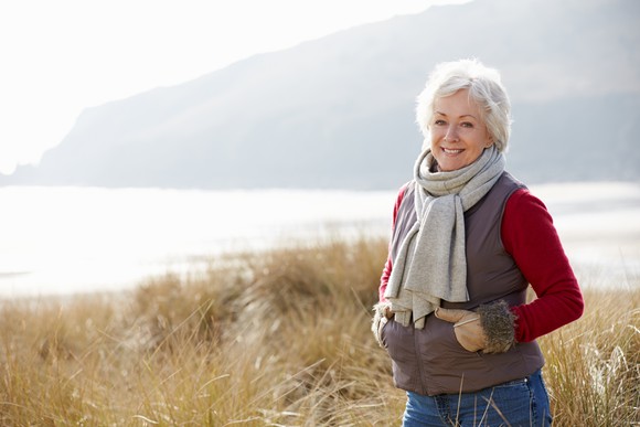 Older woman standing outdoors