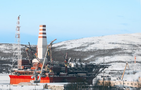 Offshore oil rig in dock during winter.
