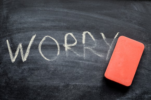 Worry written on chalkboard with eraser nearby.