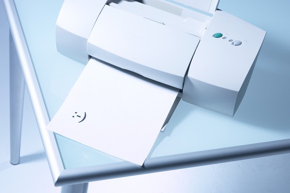 Unbranded printer, printing out a smiley.