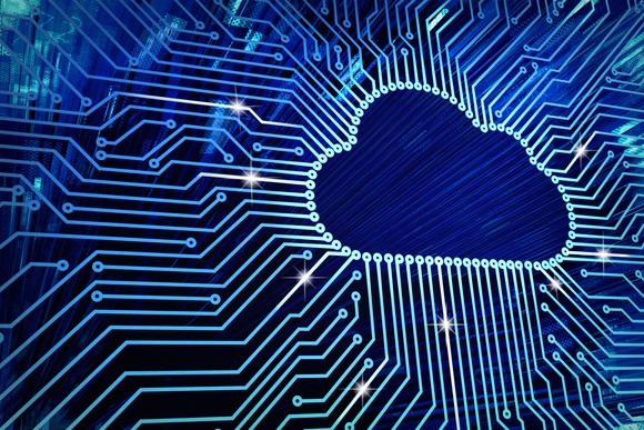 Digital lines moving toward a cloud icon.
