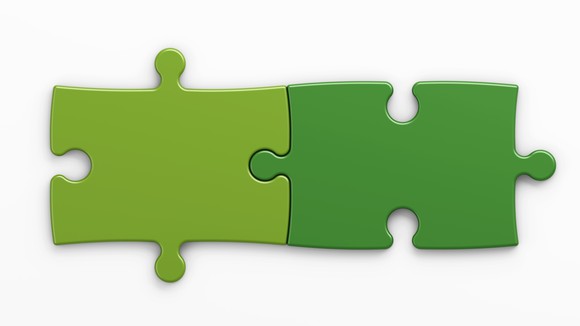 Two green jigsaw puzzle pieces joined together