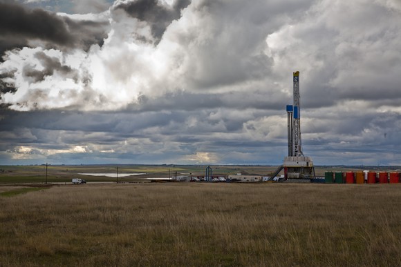 A drilling rig in North Dakota under an overcast sky