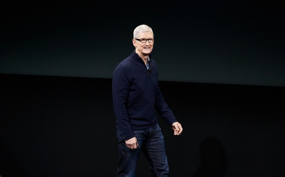 Apple CEO Tim Cook walking on stage at Apple's iPhone 7 launch.