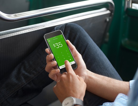 A person using the Square Cash App.