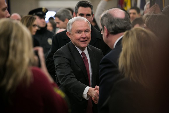 U.S. Attorney General Jeff Sessions shaking hands in crowd of people
