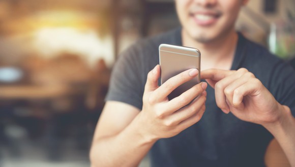 Man using cell phone.