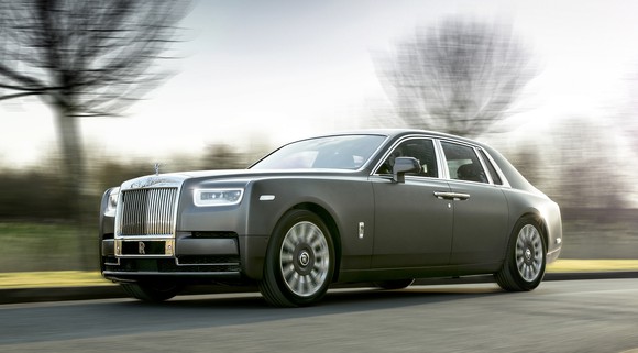 A dark gray 2018 Rolls-Royce Phantom, a large and opulent super-luxury sedan