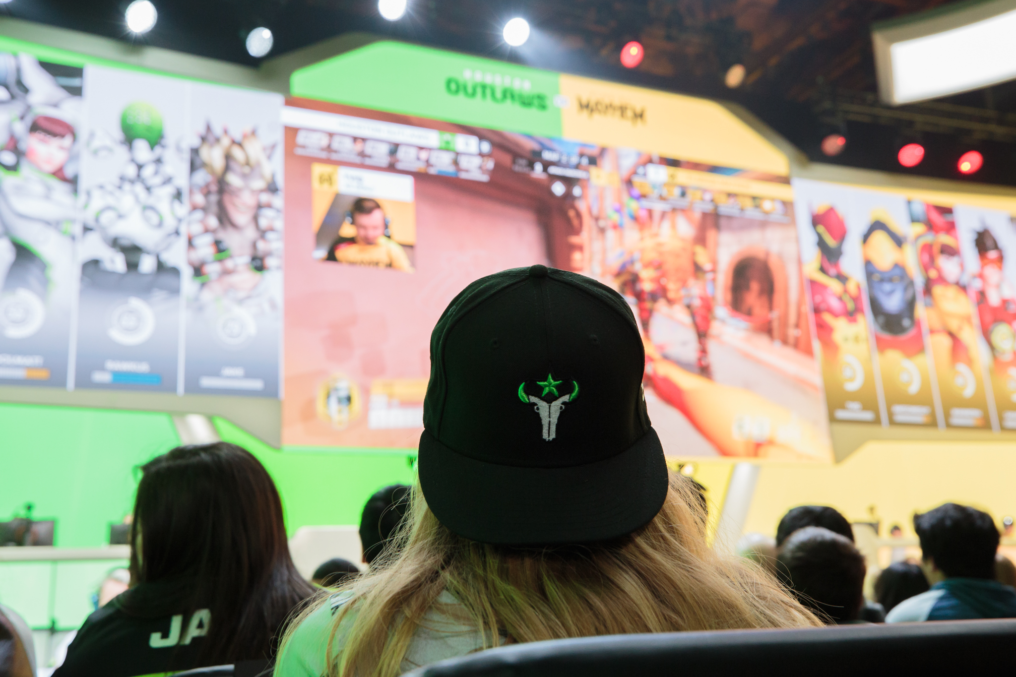 Fan watching an Overwatch League match at Blizzard Arena.