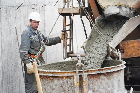 Man pouring concrete into form