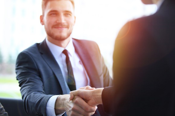 Two professionals shaking hands