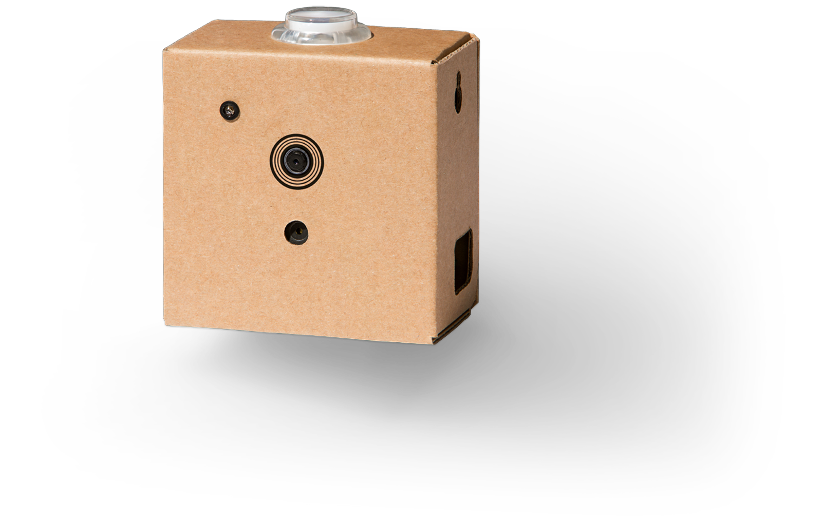 A small cardboard rectangle with a lens on the front that houses the vision kit.