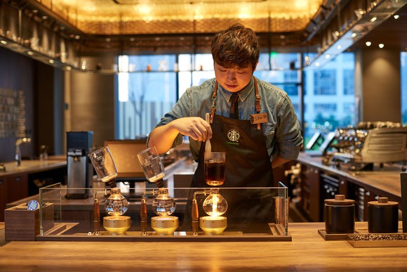 A barista works at a Starbucks in China