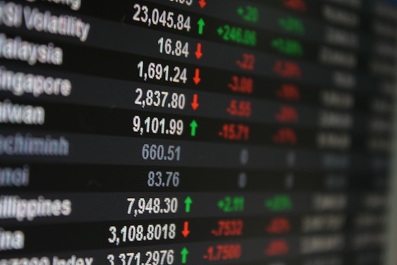 Asian stock market indices on an LED display.