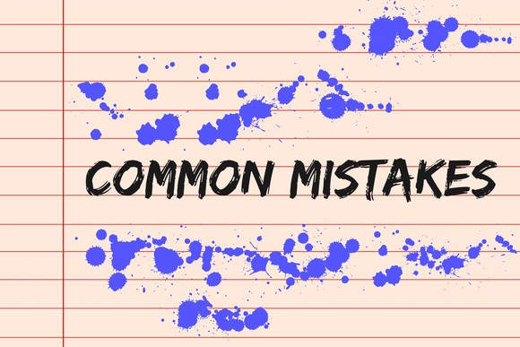 the words common mistakes written on a lined background, with spilled ink drops all around them