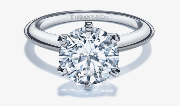 Large diamond ring with Tiffany & Co. engrained on the inside of the band.