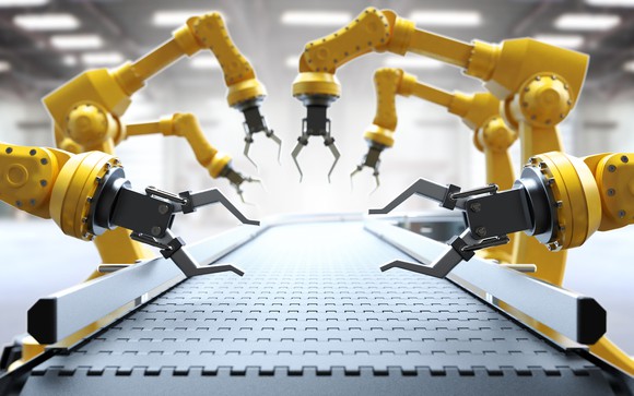 Robotic arms on a factory assembly line.