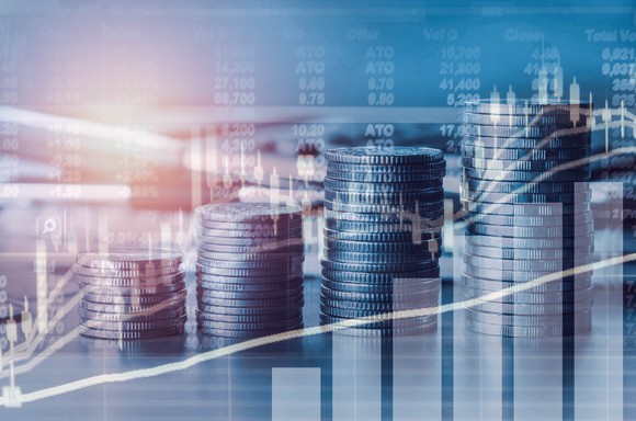 Four stacks of coins, increasing in size from left to right.