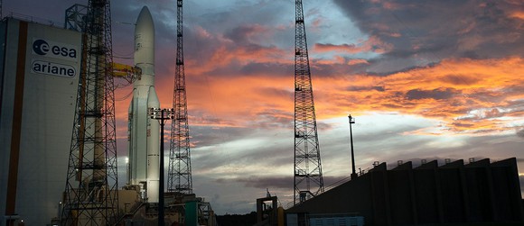 Ariane rocket on pad at sunset