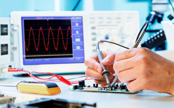 Person using an oscilloscope