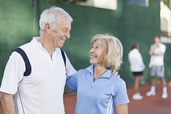 Senior couple in tennis outfits