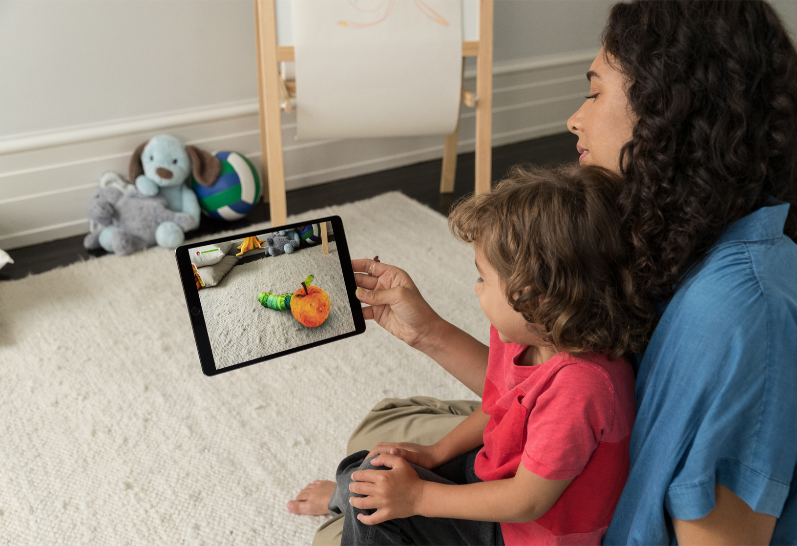 A mom using augmented reality apps with her child