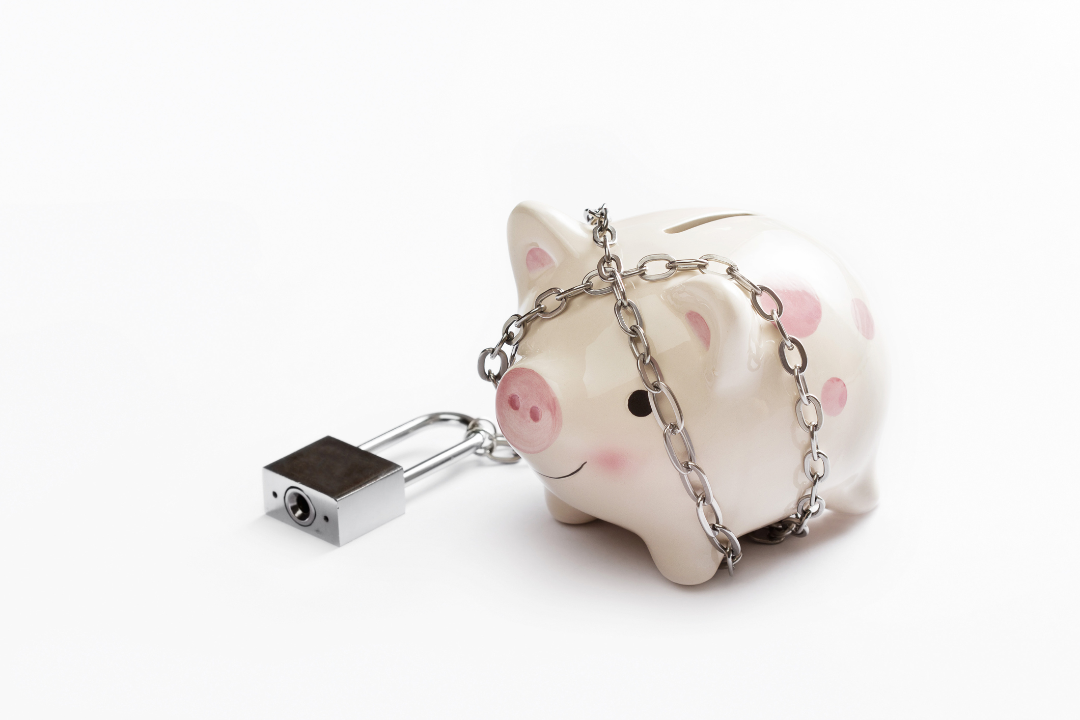 A piggy bank wrapped in a chain with a padlock