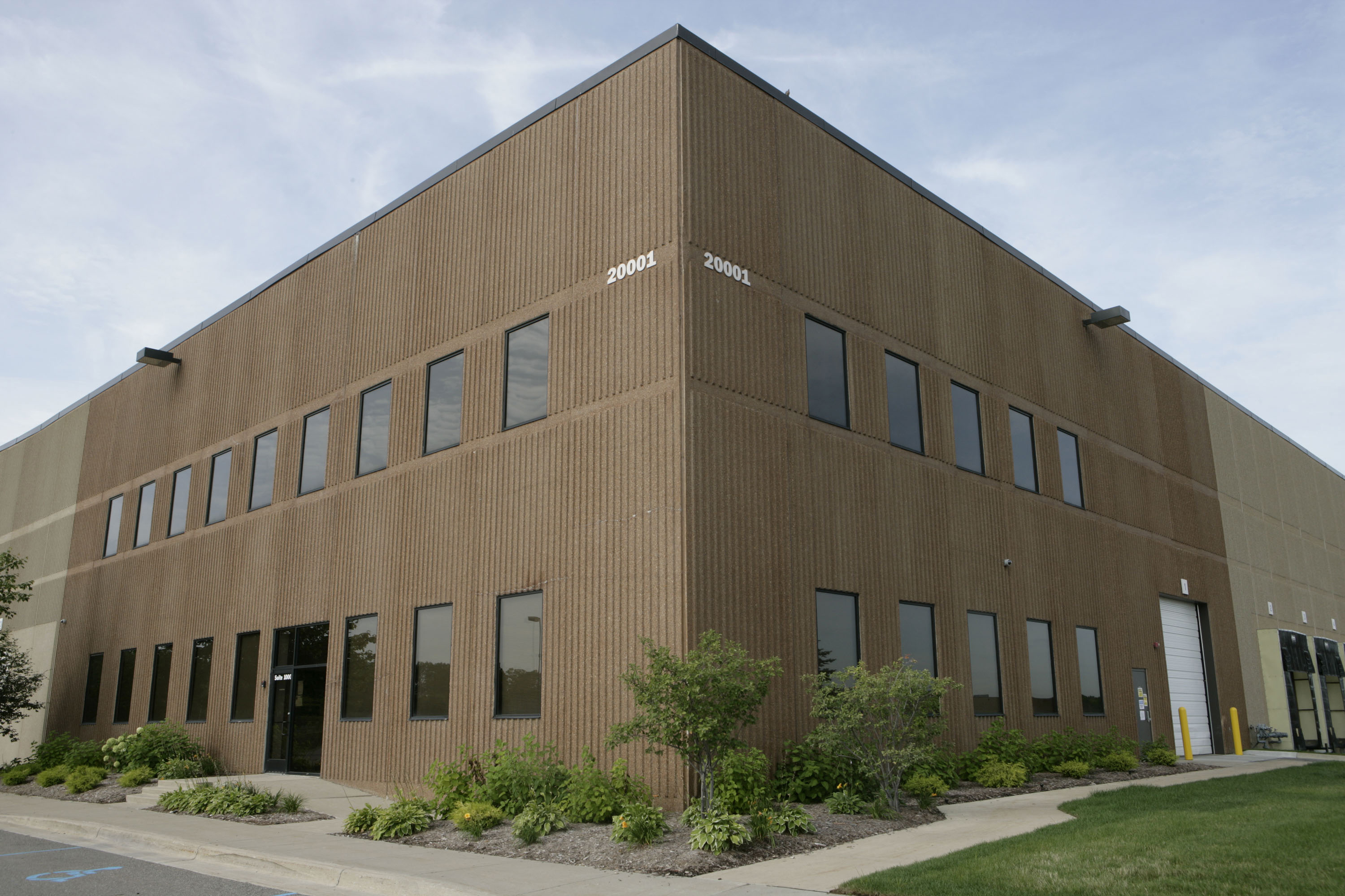 A brown two-story building.