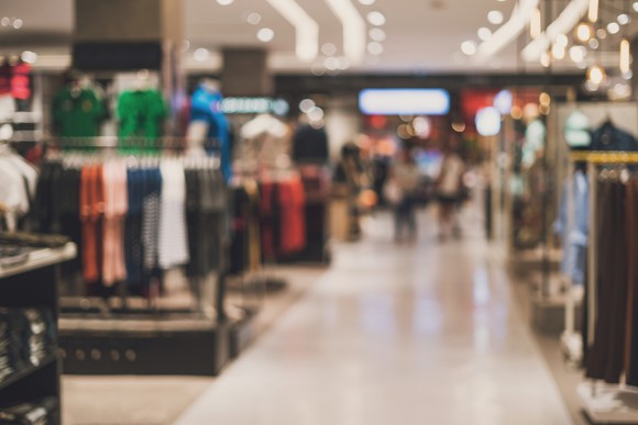 A blurry image of the inside of a department store