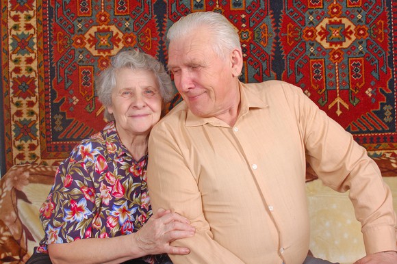 Senior couple on a couch.