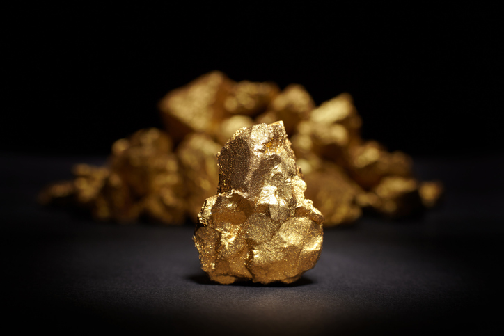 A piece of gold sitting on a table.