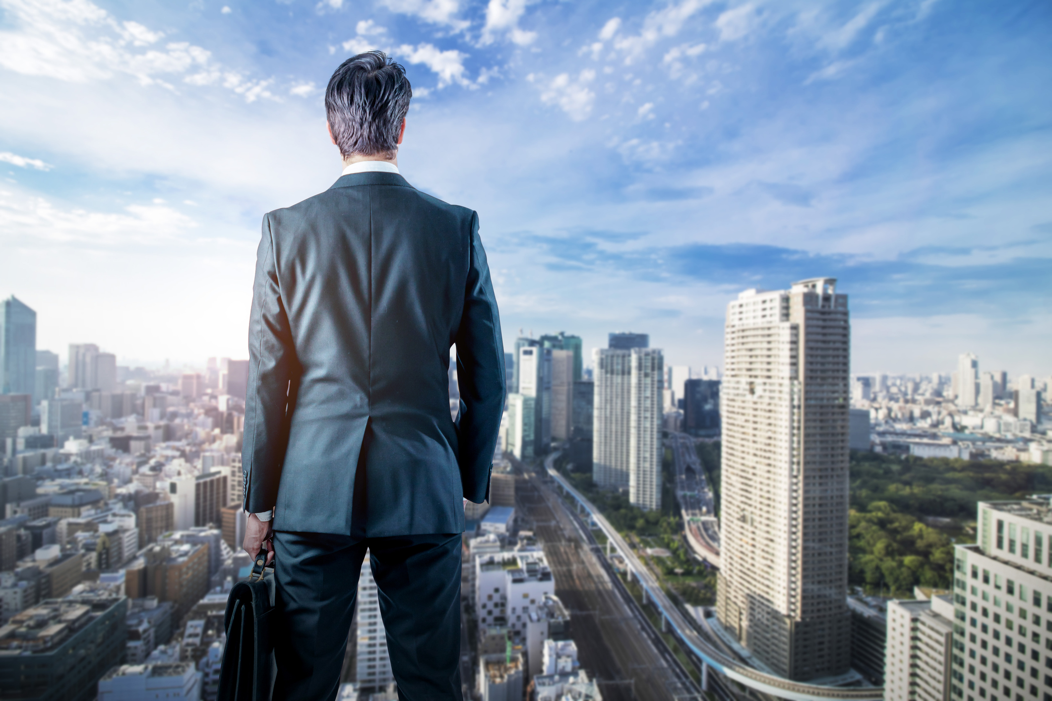 Person looking out over a city.