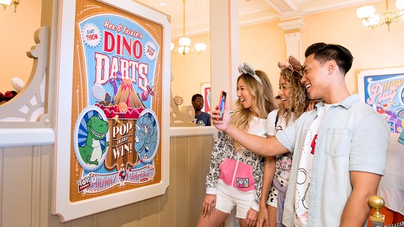Guests playing at Toy Story Midway Mania in Disneyland.