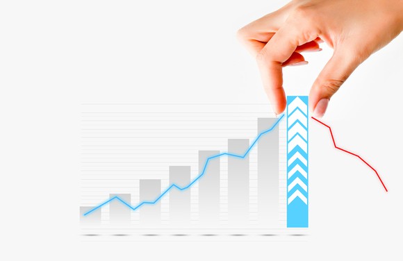 A hand pulling up the last and tallest bar in a bar chart showing growth.