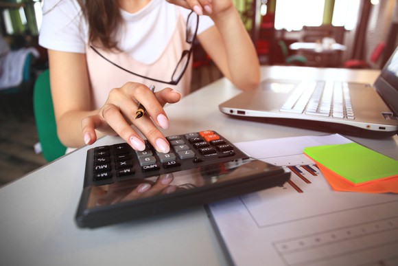 Woman using a calculator